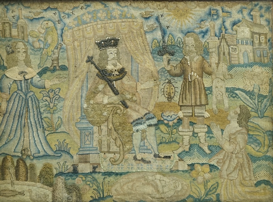 An 17th century petit point embroidered panel housed in a tortoise shell and gilt frame. The embroidery depicting Charles I, within a tent, with Henrietta Maria looking at a gentleman dangling a boy in one hand and sword